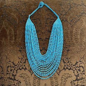 Handmade turquoise beaded and stacked necklace.